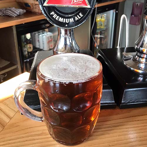 A dimpled glass tankard of premium real ale at the bar